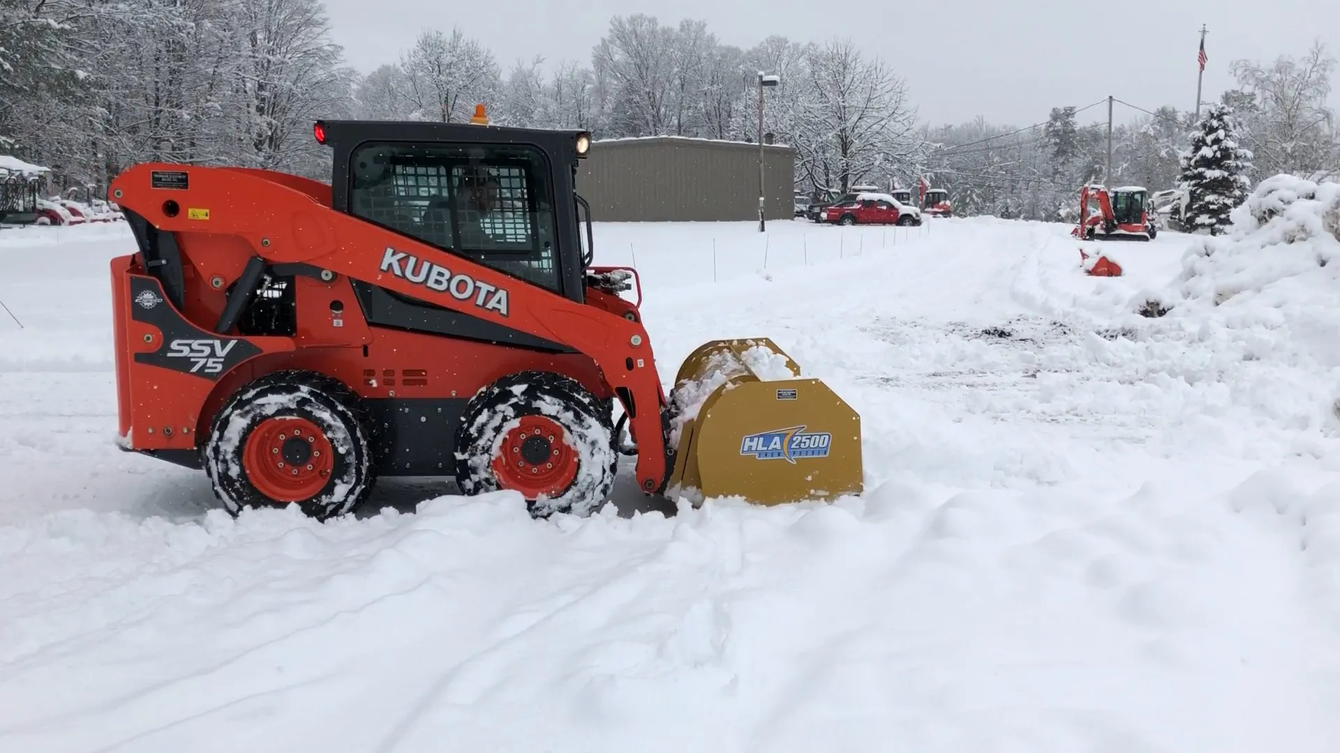 Kubota SSV75 Skid Steer with an HLA Snow Pusher Townline Equipment
